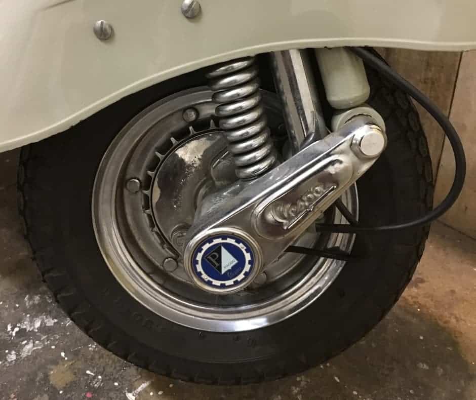 the front fork of classic Vietnamese Vespa is often changed to accommodate 10 inch wheels