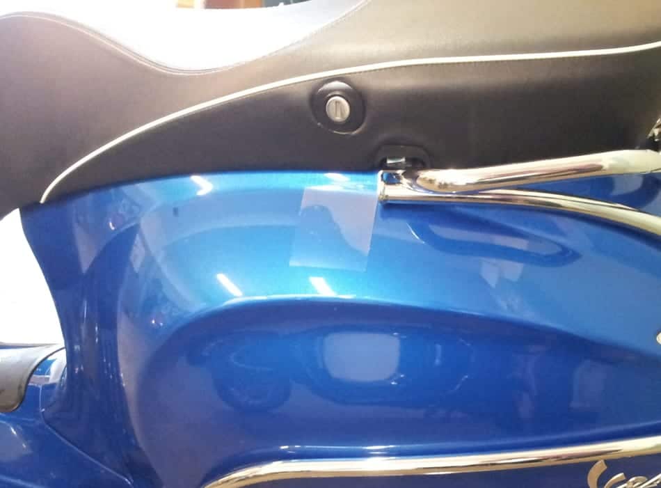 invisible sticker near the key hole on the seat of a Vespa Sprint to avoid minor scratches on the paint