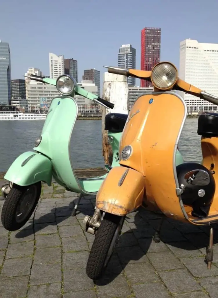 two classic Vespa 50, one repainted in pistache paint, the other in original Giallo Positano paint from 1974