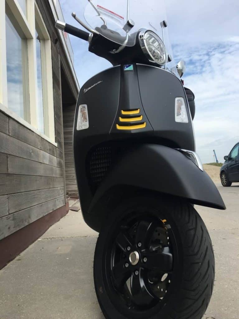 Vespa GTS300 in Matte Black color near the beach