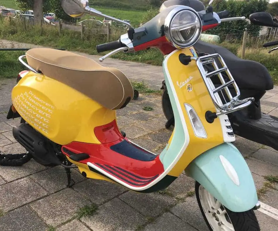 Vespa Primavera in Sean Wotherspoon colors yellow, red, sea green and dark green