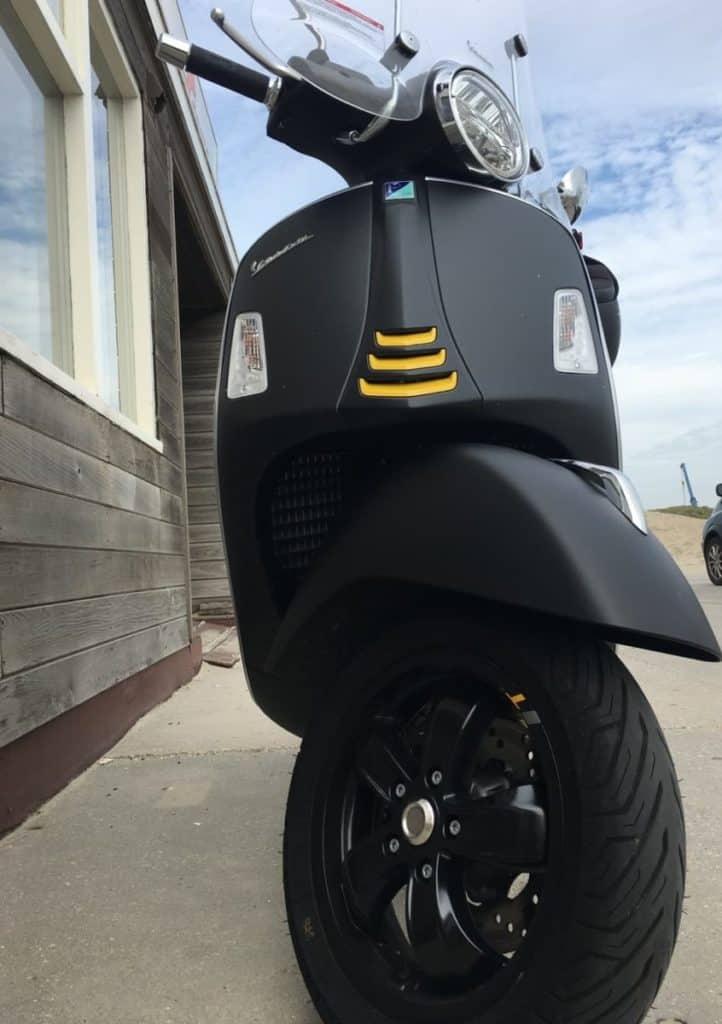 black rims on a matte Vespa Primavera 