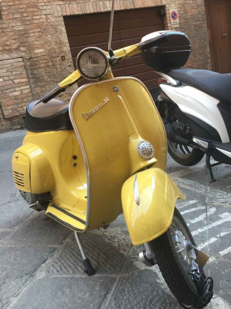 classic vespa 50 yellow italy