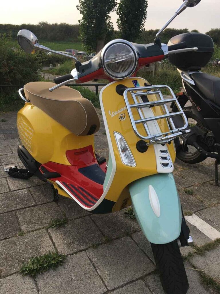 vespa primavera sean wotherspoon makes a very colourful ride