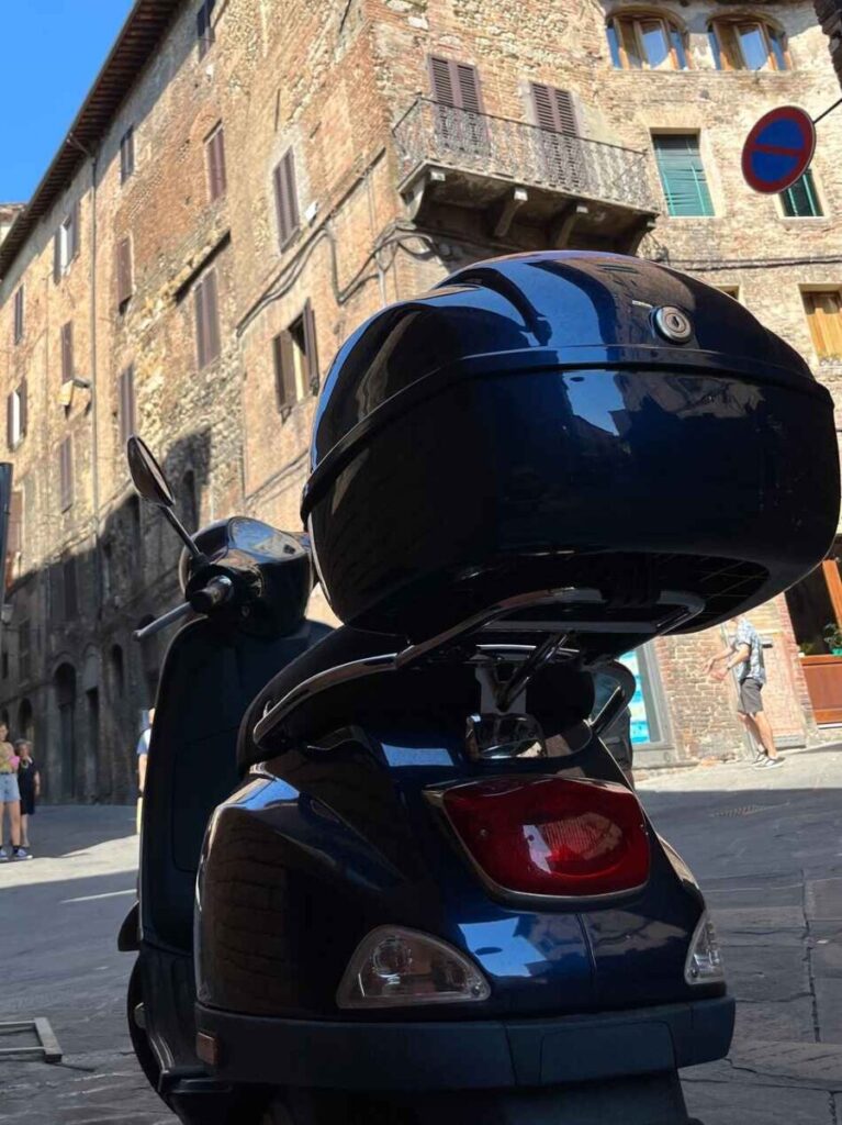 vespa lx parked in siena italy