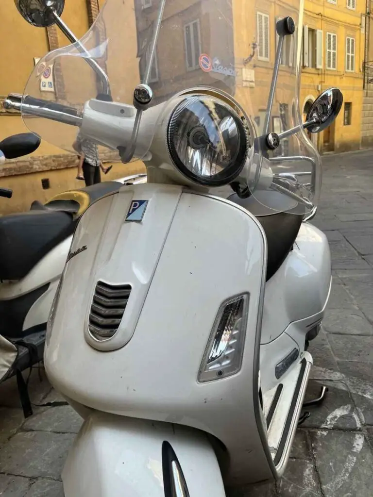 white vespa gts in florence italy