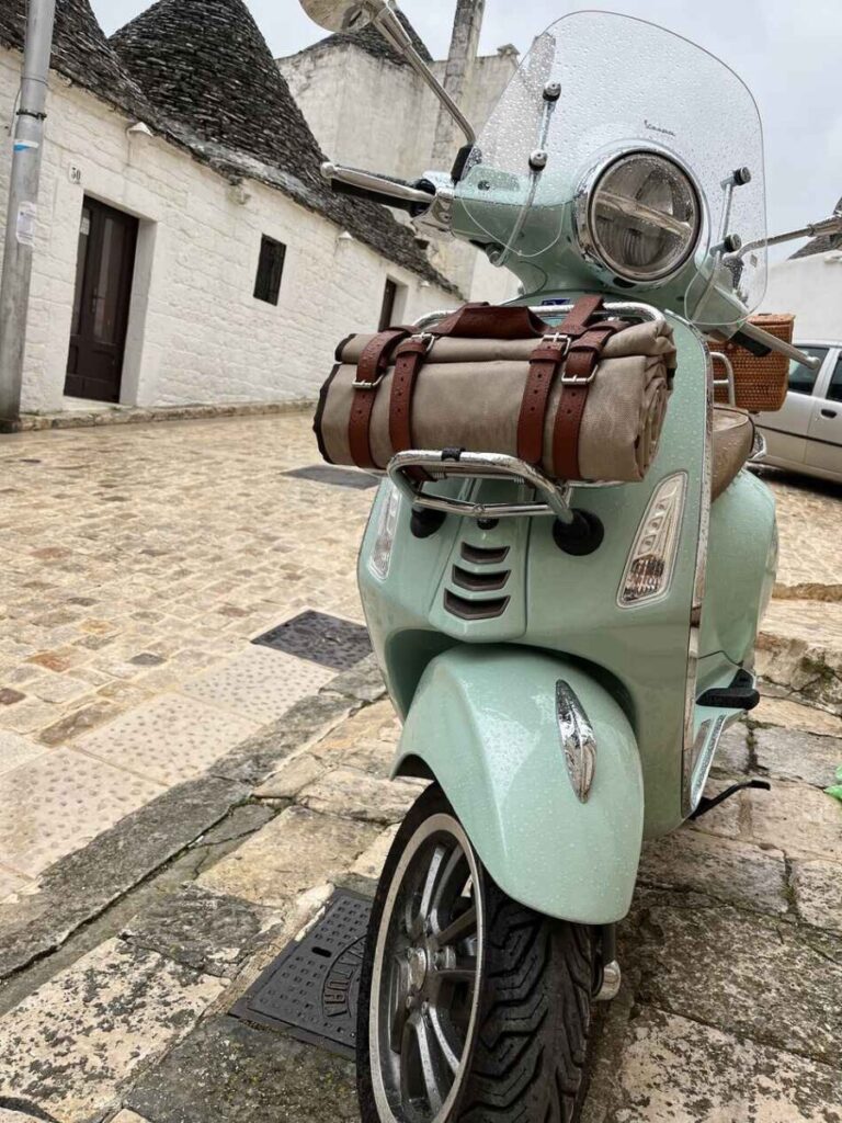 found a vespa primavera parked on a steep hill in puglia italy