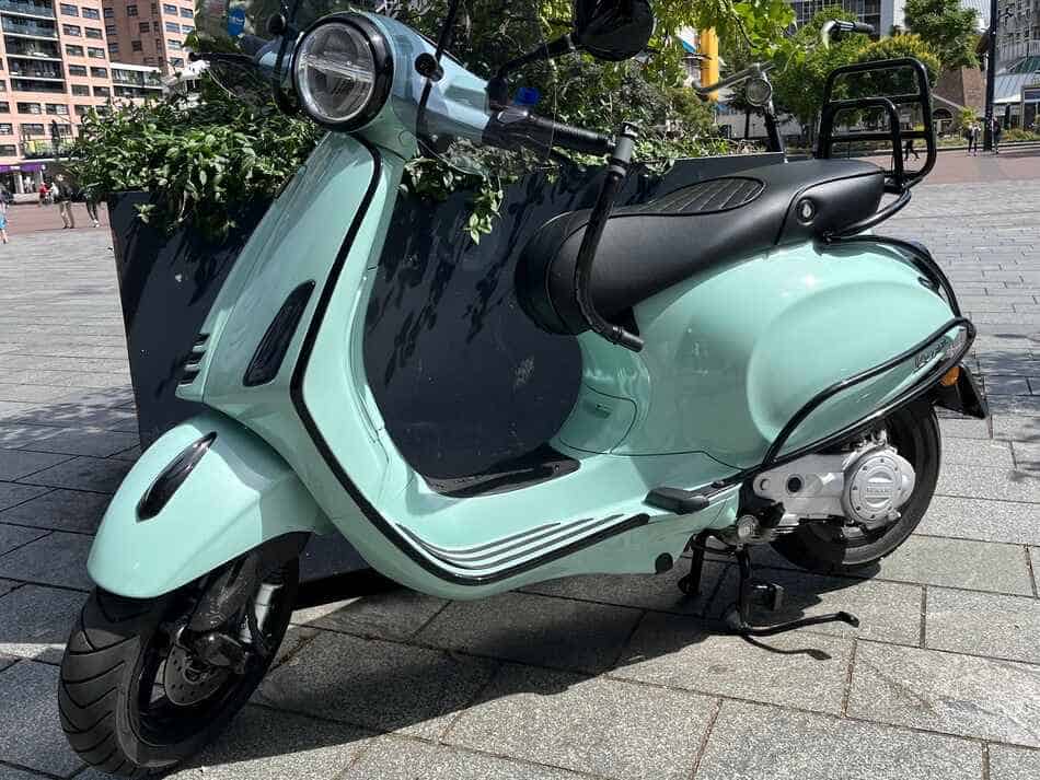 mint green primavera parked in city center